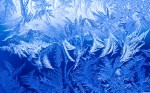 Ice crystals form on a window during sub zero temperatures