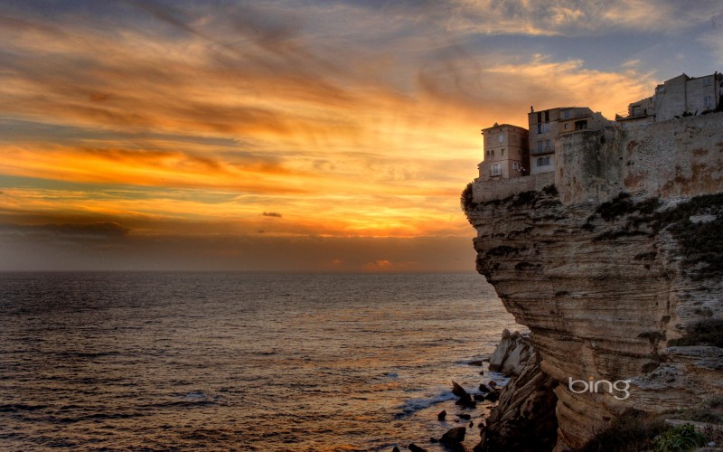 cliff at sea during sunset